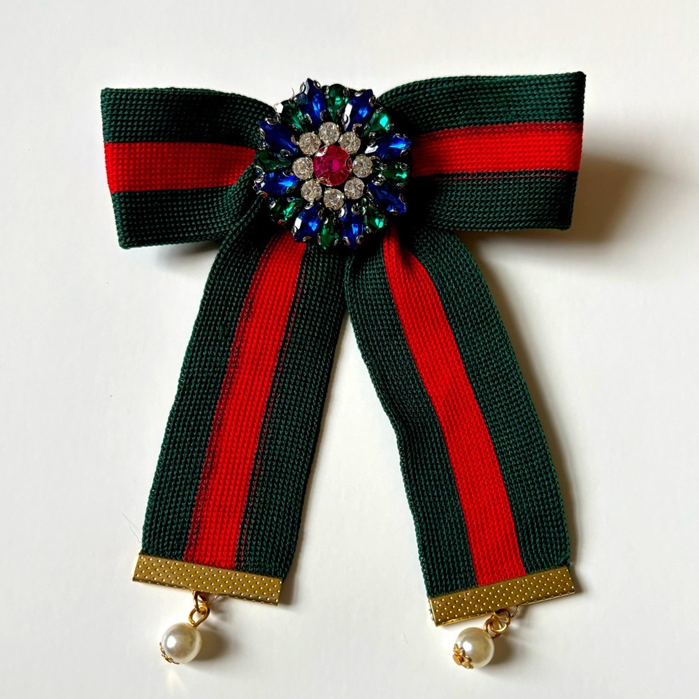 Green bejeweled bow brooch